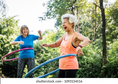 Senior Woman Exercising With A Hula Hoop