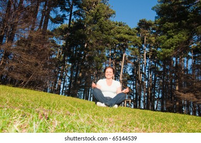 Senior Woman Exercising In Park