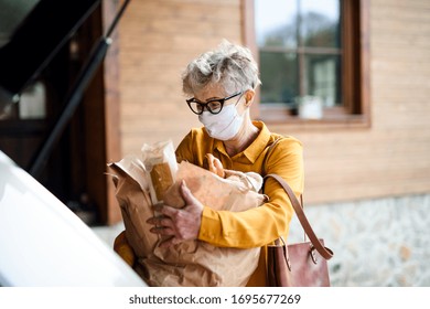 Senior Woman With Face Mask Outdoors With Shopping, Corona Virus And Quarantine Concept.