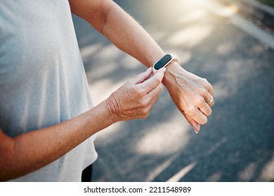 Senior Woman, Fitness Runner With Smartwatch For Results, Health And Wellness On Road Exercise, Training Or Run Workout. Watch, Running Elderly Athlete And Street, City Or Check For Marathon Time