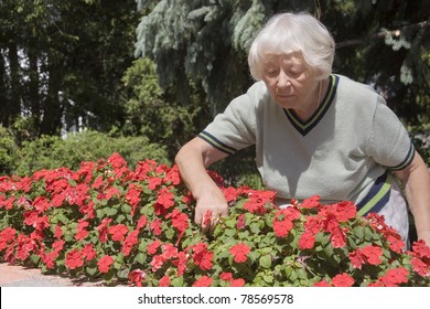 Senior woman flower garden