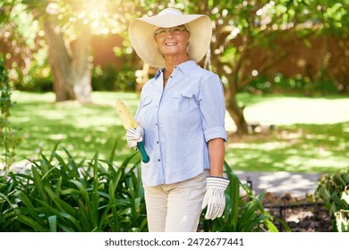 Senior woman, garden portrait and tool with summer hobby for sustainability, sunshine and growth for plants. Female person, elderly farmer and retirement with shovel and eco friendly for environment - Powered by Shutterstock