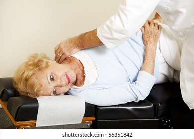 Senior woman getting an adjustment from her chiropractor. - Powered by Shutterstock