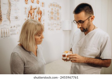 Senior woman getting the neck adjustment done in the medical office. High quality photo - Powered by Shutterstock