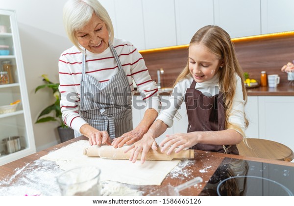 Senior Woman Giving Her Grandchild Cooking Stock Photo 1586665126 ...