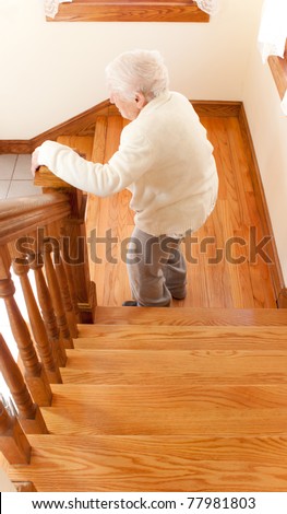 Senior Woman going down staircase