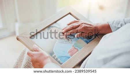 Senior woman, grief and picture of husband on lap, hands and sad of love loss in retirement. Elderly person, alone and dear memory of beloved with anxiety, mental health and lonely bereaved in house