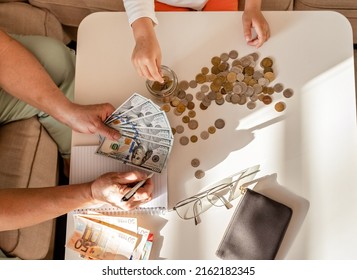 Senior Woman Hands Together With Child Counting Money Americain Dollars And Euro At Home Teaching Kid Financial Literacy Planning Budget