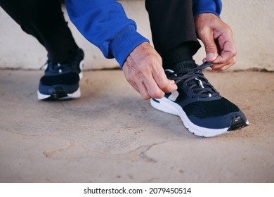 Senior woman hands tying shoelace getting ready jogging, exercising or traveling. Healthy lifestyle and well-being of senior people concepts. - Powered by Shutterstock