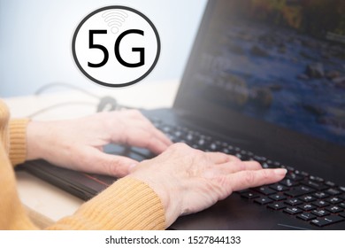 senior woman hands using laptop with 5G icon - Powered by Shutterstock