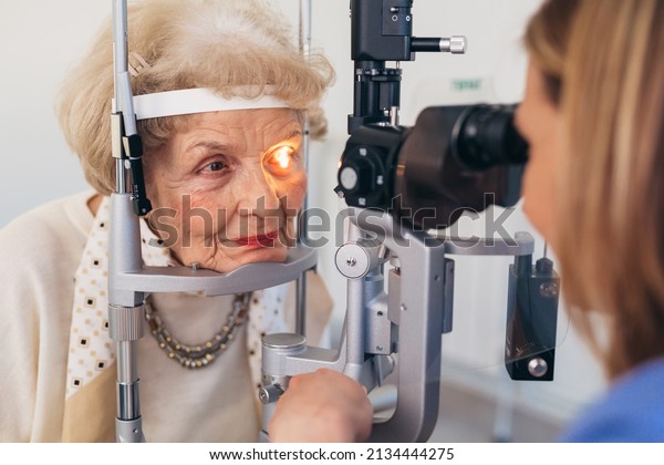 senior woman having\
eyesight examination