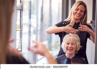 Senior Woman Having Hair Cut By Female Stylist In Hairdressing Salon - Shutterstock ID 1866584959
