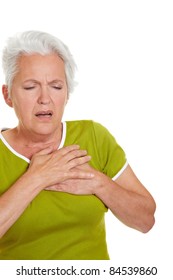 Senior Woman Having A Heart Attack And Grabbing Her Chest