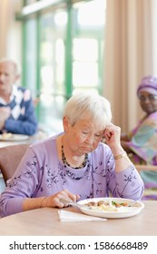 A Senior Woman Having Lunch Looking Sad