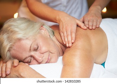 Senior Woman Having Massage In Spa