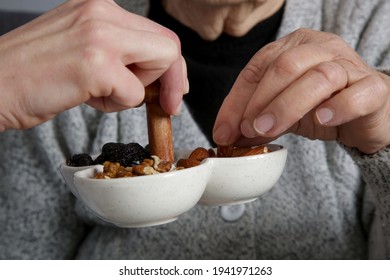 Senior Woman Having Nuts And Dried Fruits For Snack. 
Healthy Dieting And Smart Snack Choice.