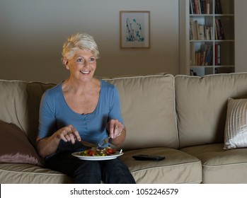 A Senior Woman Having A Tv Dinner