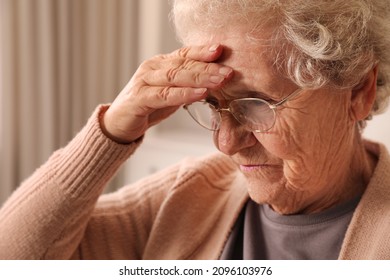 Senior Woman With Headache At Home, Closeup. Symptom Of Age-related Memory Impairment