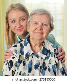 Senior Woman With Her Caregiver. Happy And Smiling. MANY OTHER PHOTOS FROM THIS SERIES IN MY PORTFOLIO.