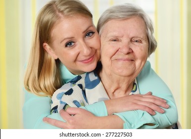 Senior Woman With Her Caregiver. Happy And Smiling. MANY OTHER PHOTOS FROM THIS SERIES IN MY PORTFOLIO.