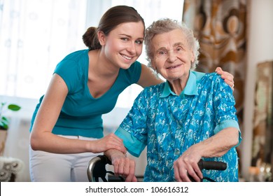 Senior Woman With Her Caregiver At Home