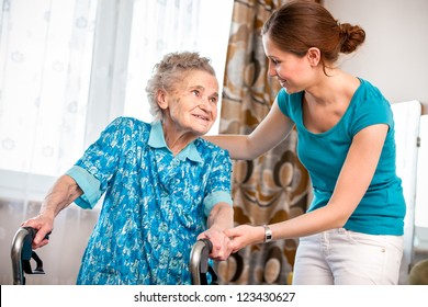 Senior Woman With Her Caregiver At Home