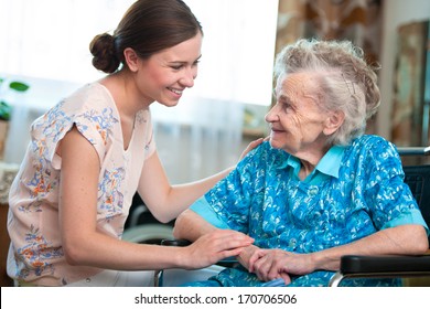 Senior Woman With Her Caregiver At Home