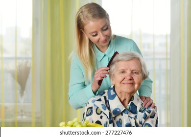 Senior Woman With Her Caregiver In Home. MANY OTHER PHOTOS FROM THIS SERIES IN MY PORTFOLIO.