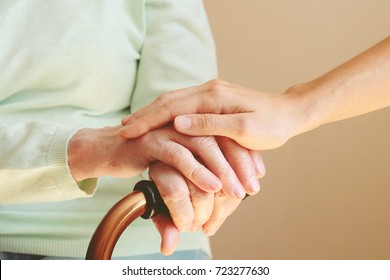 Senior Woman With Her Caregiver At Home. Concept Senior People Health Care.