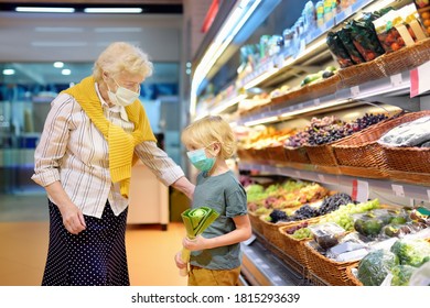 Senior Woman And Her Grandchild Wearing Disposable Medical Mask Shopping In Grocery Supermarket During Coronavirus Pneumonia Outbreak. Protection And Prevent Measures For Family While Epidemic Time.