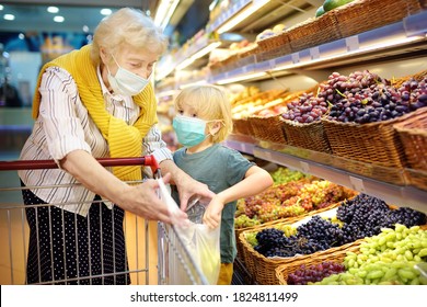 Senior Woman And Her Grandchild Wearing Disposable Medical Mask Shopping In Grocery Supermarket During Coronavirus Pneumonia Outbreak. Protection And Prevent Measures For Family While Epidemic Time.