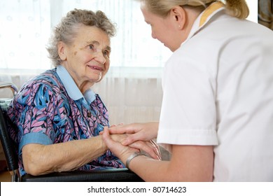 Senior Woman With Her Home Caregiver.