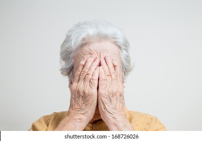 Senior Woman Hiding Her Face