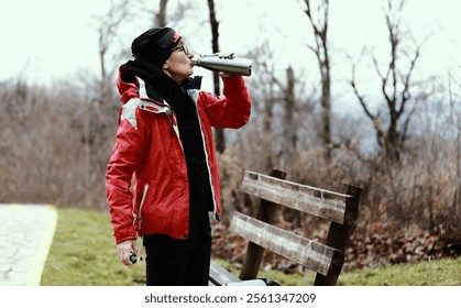 Senior woman hiking and relaxing in a beautiful sunny day. Autumn time. - Powered by Shutterstock