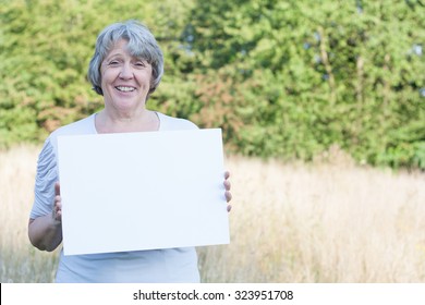 Senior Woman Holding Blank Sign