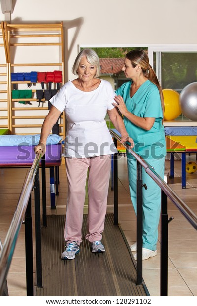 Senior Woman Holding Railing Physiotherapy Nurse Stock Photo 128291102 ...