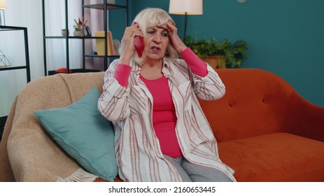 Senior Woman Holding Smartphone Talking With Doctor At Home, Complain Of Toothache, Older Retired Mature Grandmother Making Call Enjoy Mobile Modern Telecommunication Speaking By Cellphone At Home