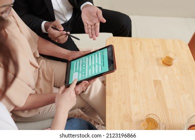 Senior Woman Holding Tablet Computer With Health Insurance Claim Form And Listening To Agent Explaining How To Fill It