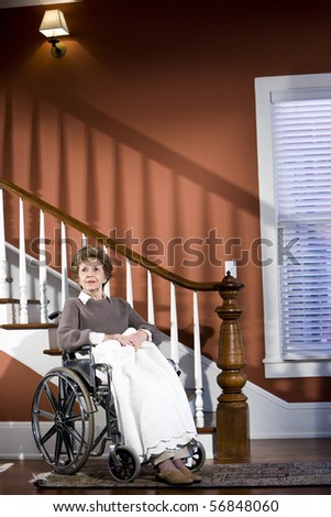 Similar – Senior woman in a wheelchair alone in a room