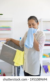 Senior Woman House Keeper Smile With Good Smell Cloth After Laundry Cleaning