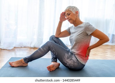 Senior Woman Injury Suffering From Backache Cause Of Fitness. Worried Sad Mature Older Woman Touching Back Feeling Ache Massaging Tensed Muscles, Upset Senior Female