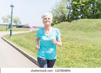 Senior Woman Jogging In Park