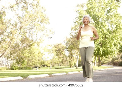 Senior Woman Jogging In Park