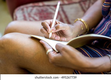 Senior Woman Journaling At Home