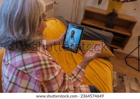 Similar – Female doctor showing an x-ray on the tablet