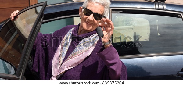 senior woman with keys of the
car