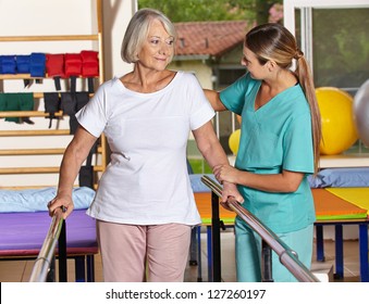 Senior woman at kinesiotherapy with physiotherapist in nursing home - Powered by Shutterstock