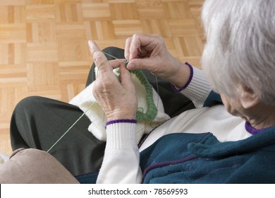 Senior woman knitting horizontal