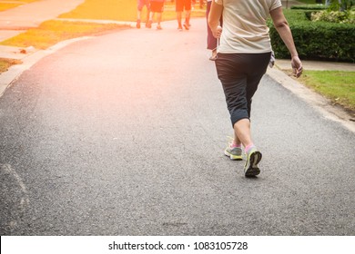 Senior Woman Legs Walking Exercise At Public Park . Selective Focus