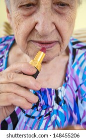 Senior Woman With Lip Stick (doing Makeup)